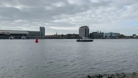 Dutch border control vessel is passing through IJ bay. Amsterdam, Netherlands Stock-Footage 161027068