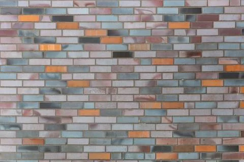 Dutch clinker dark bricks pattern in different tones of orange grey and red Stock Photos
