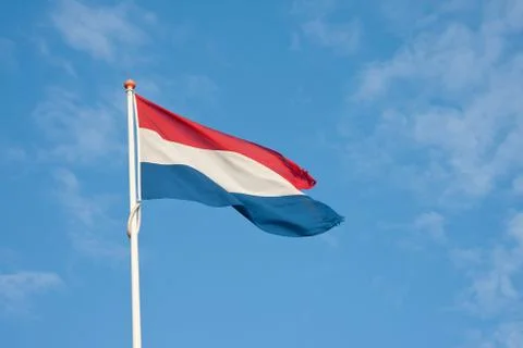 Dutch flag blowing in the wind Stock Photos