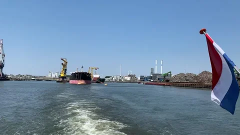 Dutch flag is waving on the back of moving boat. Rotterdam, The Netherlands Stock Footage 248767335
