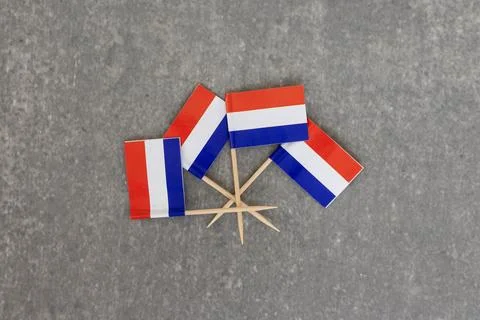 Dutch Flags Arranged in Circle Pattern on Gray background Stock Photos