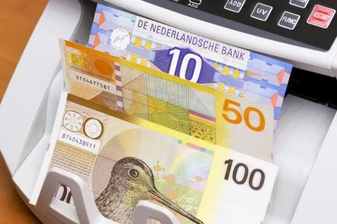 Dutch guilder in the counting machine Stock Photos