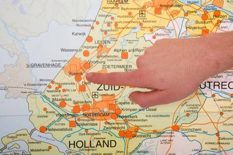 A Dutch map with a hand pointing to the governmental city The Hague Stock Photos
