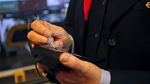 Dutch NS Train Conductor with a Digital Device Stock Footage 82879110