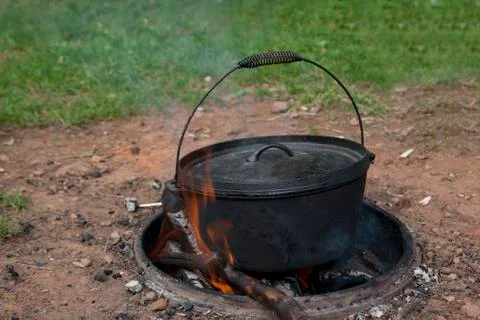 Dutch oven cooking on a campfire Stock Photos