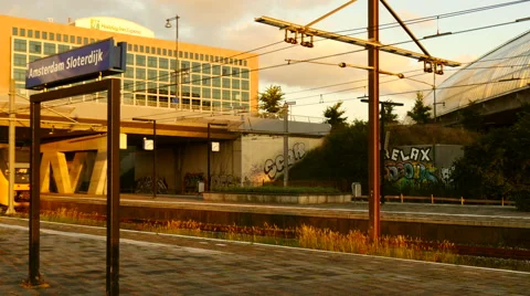 Dutch passenger train leaving Amsterdam Sloterdijk. 4k footage. Stock Footage 66928848
