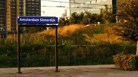 Dutch passenger train leaving train station Amsterdam Sloterdijk. Stock Footage 66937698