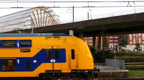 Dutch passenger train leaving train-station. Stock Footage 66940537