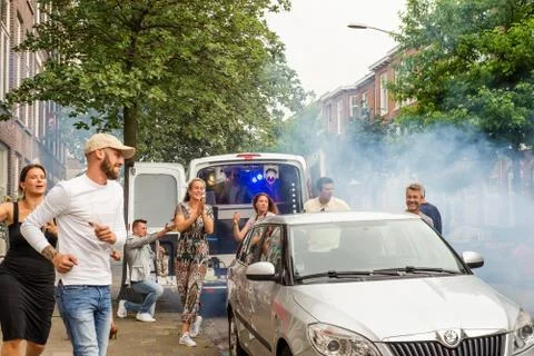 Dutch people clapping and dacing at a social distancing party in The Hague Stock Photos