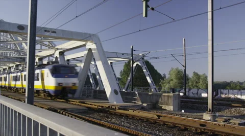 Dutch Railways train passing the classic steel bridge Stock Footage 42724447