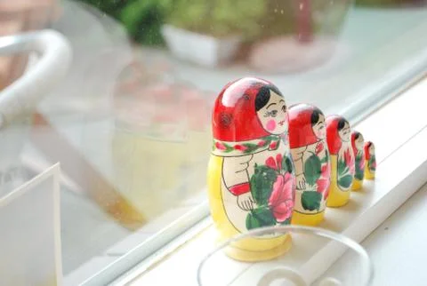 Dutch stacking dolls by the window Stock Photos