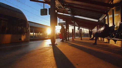 A Dutch train entering the platform at sunset in slowmotion Video stock 49454956