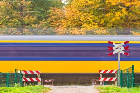 Dutch train passing a crossing Stock Photos