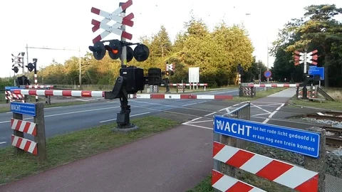 Dutch train through crossing 動画素材 114020566