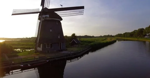 Dutch Windmill and Polder (diked marsh) - drone 4K Stock Footage 76700286