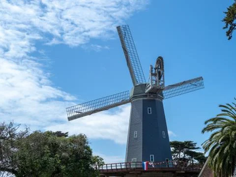 A Dutch windmill with clouds moving to the left Stock Photos