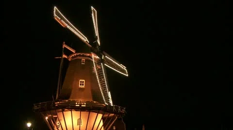 Dutch windmill with lights at night, close at angle Stock Footage 13363321