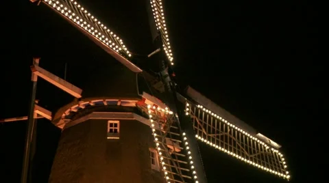 Dutch windmill with lights at night - close tilt Stock Footage 13363644
