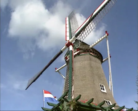 Dutch windmill milling - low angle Stock Footage 27657257