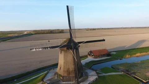 Dutch windmill with open field in the back shot by drone most downloaded 動画素材 128385276