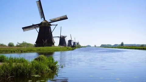 Dutch windmill over river waters Stock Footage 112305483