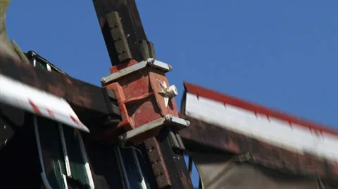 Dutch Windmill turning counterclockwise - close up windshaft + zoom out Stock Footage 34526138