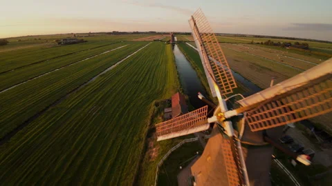 Dutch Windmills and Fields of Green Captured from Above at Sunset Stock Footage 278337990