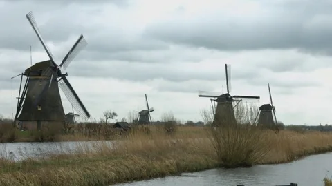 Dutch windmills by canal Stock Footage 86754521