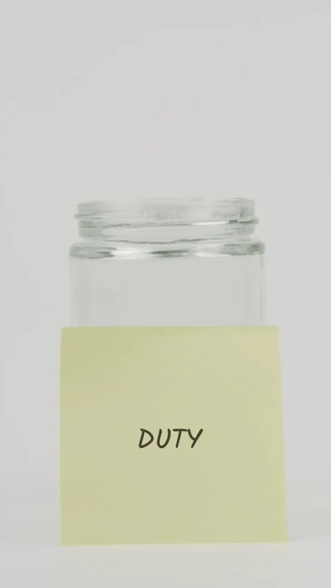 Duty text or word on yellow sticky note attached to glass jar with hand Stock Footage 311722293