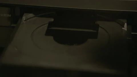 DVD BEING CHANGED IN DVD TRAY - SLOW MO Stock Footage 141656102