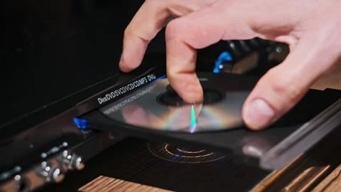 DVD Compact Disc is Inserted Into The Player Video stock 260913276