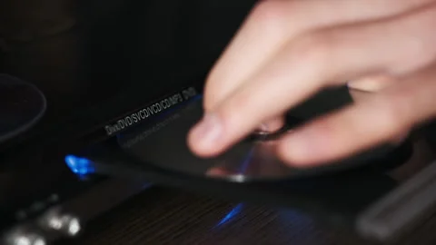 DVD Compact Disc is Inserted Into The Player Video stock 263506198
