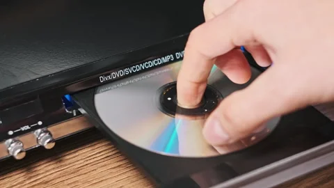 DVD Compact Disc is Inserted Into The Player Stock Footage 263583317