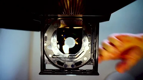 DVD Disc Inserted Into Drive, Camera Looking Up, Blue-Yellow Lighting, HD Stock Footage 234478958