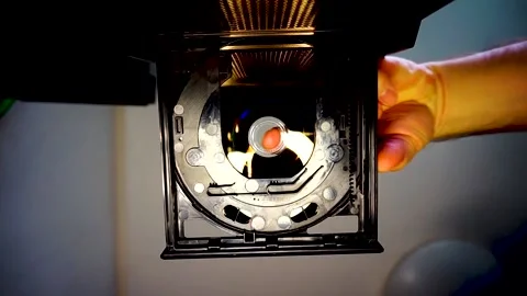 DVD Disc Inserted Into Drive, Camera Looking Up, Soft Yellow Light, HD Stock Footage 234478961