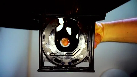 DVD Disc Removed From Drive, Camera Looking Up, Blue-Yellow Lighting, HD Stock Footage 234478955