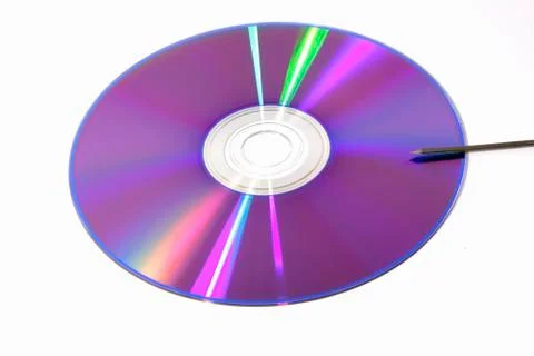 DVD with nail ready to scratch it Stock Photos