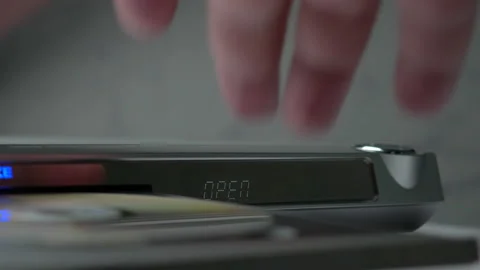 DVD Player Display. Eject Tray And Insert Disc In DVD-player. Male Hand Loading  스톡 동영상 135602791