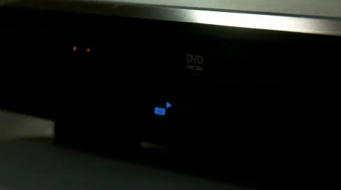 DVD player ejects, hand enters and takes disc - Editorial Stock Footage 661057