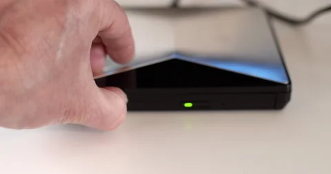 DVD player optical drive door closing with a DVD inside Stock Footage 236076507