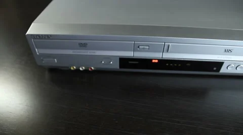 DVD Player-pull DVD from tray-insert med shot MVI-4704 Stock Footage 1042331