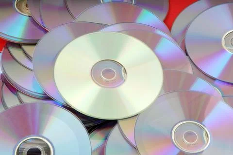 DVDs neatly arranged on a table Stock Photos