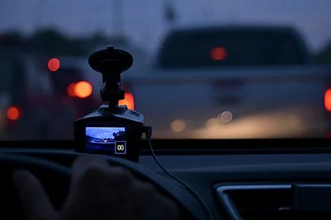 The DVR on the car panel, fixing of the stopped car. On the road during traffic Stock Photos
