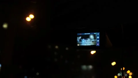 The DVR works in the car. Automol moves through the night city. Night lights of Stock Footage 217419346