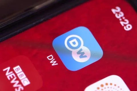 DW - Deutsche Welle mobile application on smartphone screen Stock Photos