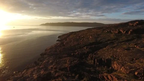 Dwarf birch, moss-covered stones. A large lake in Russia, Murmansk region, Kola Stock-Footage 104546396