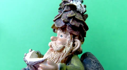 Dwarf Figure. Green background. Rotating. Video stock 35933694