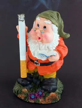A dwarf with a lit cigarette Stock Photos