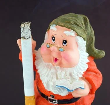 A dwarf with a lit cigarette Stock Photos