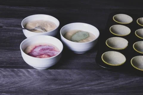 Dye is added to the cupcake dough. Stock Photos
